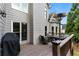 Charming outdoor patio with grill and comfortable seating area, perfect for entertaining with mature tree backdrop at 1254 Hadaway Garden Nw Dr, Kennesaw, GA 30152