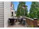 Cozy outdoor deck seating area with a heat lamp, offers comfortable spot for relaxation and entertaining at 1254 Hadaway Garden Nw Dr, Kennesaw, GA 30152