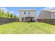 Fenced backyard with a well-manicured lawn, patio, gazebo, and outdoor recreational area at 3350 Clawing Hawk Way, Douglasville, GA 30135