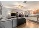 Spacious living area flows into dining and kitchen areas, featuring wood floors and modern decor at 3350 Clawing Hawk Way, Douglasville, GA 30135