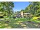 Lush backyard with neatly trimmed grass and landscaped flower beds at 400 Little John Nw Dr, Lilburn, GA 30047