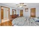 Comfortable bedroom with wood flooring and ample natural light coming from the window at 400 Little John Nw Dr, Lilburn, GA 30047