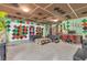Bright bonus room with custom ceiling, decor accents, and ample seating space at 400 Little John Nw Dr, Lilburn, GA 30047