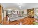 Open concept living room and dining area with hardwood floors and ample seating space at 400 Little John Nw Dr, Lilburn, GA 30047