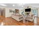 Spacious living room features hardwood floors, vaulted ceilings, and a cozy fireplace at 400 Little John Nw Dr, Lilburn, GA 30047