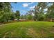 Expansive backyard featuring a large grassy area and a wood fence at 1031 Washington Ave, Woodstock, GA 30188