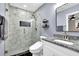 Modern bathroom features tiled shower and granite countertop vanity at 1031 Washington Ave, Woodstock, GA 30188