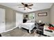 Bedroom with a ceiling fan, closet and a well-lit ambiance at 1031 Washington Ave, Woodstock, GA 30188