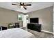 Bedroom with a ceiling fan, closet and a desk with chair at 1031 Washington Ave, Woodstock, GA 30188