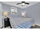 Comfortable bedroom featuring a ceiling fan and natural light from the window at 1031 Washington Ave, Woodstock, GA 30188