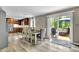 Bright dining area next to kitchen and glass doors, with a cozy table and modern chairs at 1031 Washington Ave, Woodstock, GA 30188
