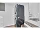 Modern stackable washer and dryer located adjacent to the stairs at 1031 Washington Ave, Woodstock, GA 30188