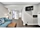 Open-concept living space with hardwood floors and a built-in microwave oven at 1031 Washington Ave, Woodstock, GA 30188