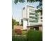 Modern white and glass office building with greenery and stone accents in a suburban setting at 11255 Knollwood Bnd, Johns Creek, GA 30097