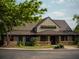 Exterior view of Stoney River Steakhouse and Grill with stone accents, set in a landscaped surrounding at 11255 Knollwood Bnd, Johns Creek, GA 30097