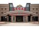 Exterior view of the Regal RPX building showing the main entrance and signage at 11255 Knollwood Bnd, Johns Creek, GA 30097