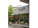 Attractive exterior view of building One 41 with brick and gray metal facade with awnings at 11255 Knollwood Bnd, Johns Creek, GA 30097