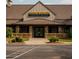 Close up view of the Stoney River Steakhouse and Grill exterior with well manicured shrubs at 11255 Knollwood Bnd, Johns Creek, GA 30097