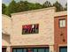 The building's exterior is stone with Angelos's Pizza sign and large storefront windows at 11255 Knollwood Bnd, Johns Creek, GA 30097
