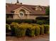 Exterior view of a beige building with a brown roof and a manicured lawn with trimmed bushes at 11255 Knollwood Bnd, Johns Creek, GA 30097