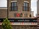 View of a brick building with an 'Uncle Jack's' restaurant sign and visible 'scratch plates' tagline at 11255 Knollwood Bnd, Johns Creek, GA 30097