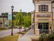 Street view of commercial building featuring First Watch restaurant in a retail complex at 11255 Knollwood Bnd, Johns Creek, GA 30097