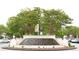 Attractive fountain in a retail shopping district with landscaping and trees at 11255 Knollwood Bnd, Johns Creek, GA 30097