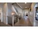 Hallway with hardwood floors, staircase, and an open view into the bedroom at 11255 Knollwood Bnd, Johns Creek, GA 30097