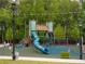 View of an outdoor playground with a blue slide and swings at 11255 Knollwood Bnd, Johns Creek, GA 30097