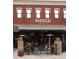 Exterior view of Mavericks So-Cal Mexican Cantina with outdoor seating and brick facade at 11255 Knollwood Bnd, Johns Creek, GA 30097