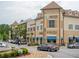 Exterior shot of the shopping center with various businesses and architecture at 11255 Knollwood Bnd, Johns Creek, GA 30097