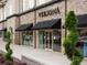 Exterior shot of the front of the store with stone facade and glass storefront at 11255 Knollwood Bnd, Johns Creek, GA 30097