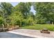 Large backyard featuring a wooden pergola, patio, picnic table, and lots of space for recreation at 307 S Mcdonough St, Decatur, GA 30030