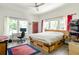 Spacious bedroom with lots of natural light and a king-size bed with storage drawers at 307 S Mcdonough St, Decatur, GA 30030