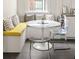 Cozy dining nook features built-in seating, a round table, and clear modern chairs at 307 S Mcdonough St, Decatur, GA 30030