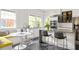 Bright kitchen with white cabinetry, stainless appliances and a built-in breakfast nook at 307 S Mcdonough St, Decatur, GA 30030