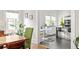 Kitchen with stainless appliances, table, chairs, and white cabinets at 307 S Mcdonough St, Decatur, GA 30030