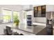 Updated kitchen featuring stainless steel appliances, modern cabinetry, and a large center island at 307 S Mcdonough St, Decatur, GA 30030