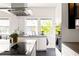 Contemporary kitchen with stainless appliances, light counter tops, and a center island at 307 S Mcdonough St, Decatur, GA 30030