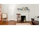 Inviting living room showcasing a decorative fireplace, hardwood floors, and natural light at 307 S Mcdonough St, Decatur, GA 30030