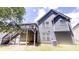 Two story exterior view of house with a deck, stairs, and a grassy backyard at 3157 Peartree Nw Dr, Acworth, GA 30101