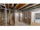 Unfinished basement space with wooden beams, exposed ceilings and walls, with potential for customization at 3157 Peartree Nw Dr, Acworth, GA 30101