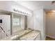 A primary bathroom has a granite vanity, a jetted tub, and a window at 3157 Peartree Nw Dr, Acworth, GA 30101