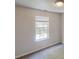 Well-lit bedroom with neutral walls, soft carpet, and a large window at 3157 Peartree Nw Dr, Acworth, GA 30101