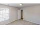 A spare bedroom features a window and closet at 3157 Peartree Nw Dr, Acworth, GA 30101