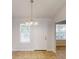 Dining area featuring tile floor, chandelier, and large windows for ample sunlight at 3157 Peartree Nw Dr, Acworth, GA 30101