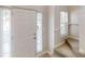 Inviting entryway featuring a white front door, natural light, and staircase access to the home's upper level at 3157 Peartree Nw Dr, Acworth, GA 30101