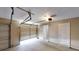 Two-car garage with a door to the home featuring a clean concrete floor and ample room for parking at 3157 Peartree Nw Dr, Acworth, GA 30101