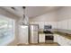 Kitchen with stainless steel appliances, granite countertops, and ample white cabinetry at 3157 Peartree Nw Dr, Acworth, GA 30101