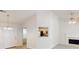 Bright and airy living room with high ceilings, fireplace, and view into the kitchen at 3157 Peartree Nw Dr, Acworth, GA 30101
